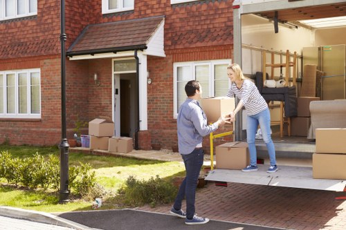 Local man and van removal service loading furniture in Hampton Hill
