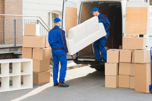 Loading furniture into a removals van in Hampton Hill