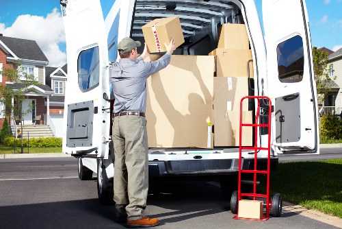 Professional movers loading furniture for a flat or house move