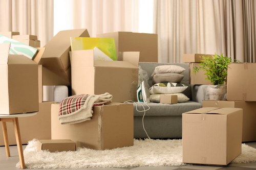 Unpacking household items in a Hampton Hill property