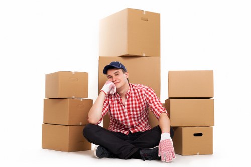 Moving boxes and household items with a van in Hampton Hill